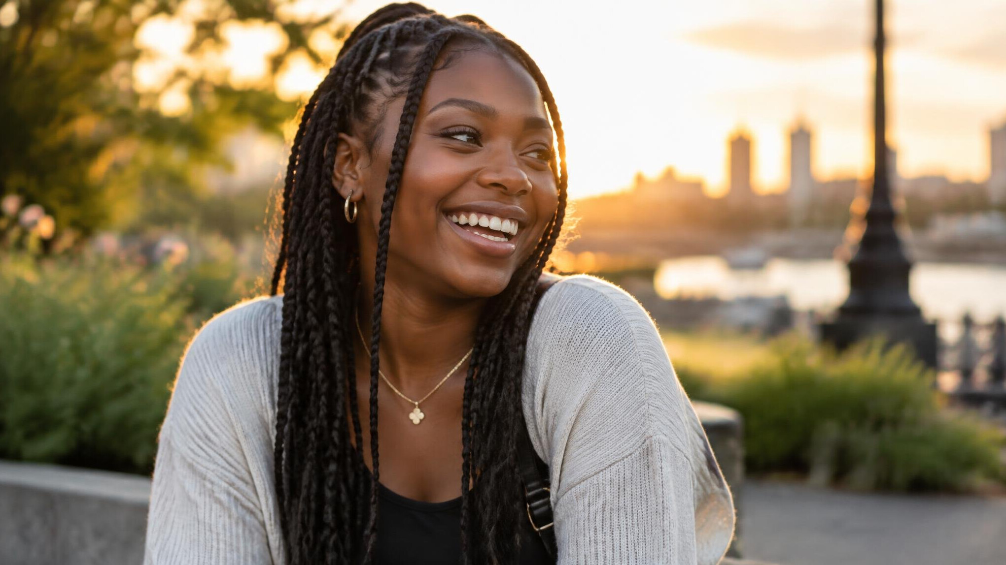 Candid lifestyle photograph of a woman laughing outdoors